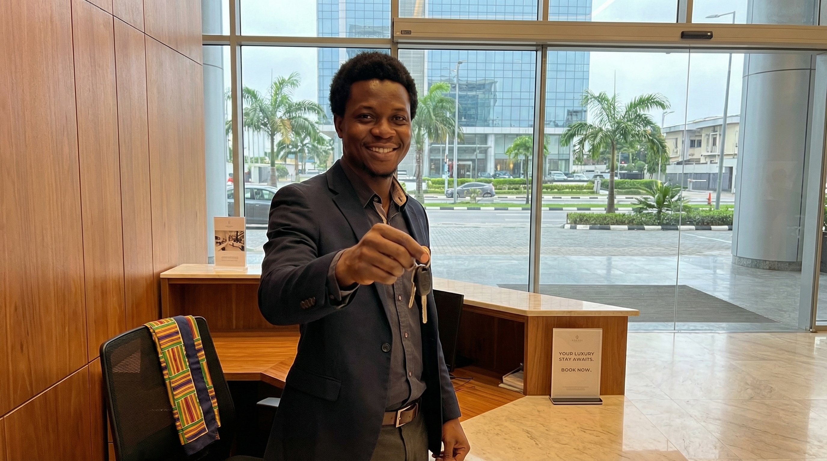 Professional with keys, welcoming gesture. Global connectivity and excellence.